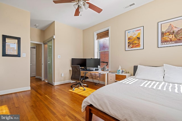 bedroom featuring ceiling fan and light hardwood / wood-style floors