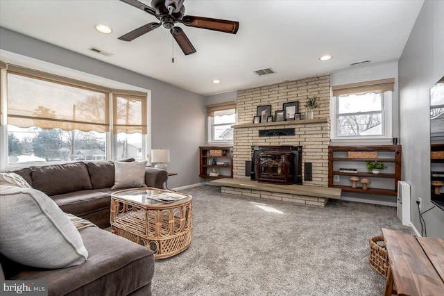 living room featuring ceiling fan and carpet flooring