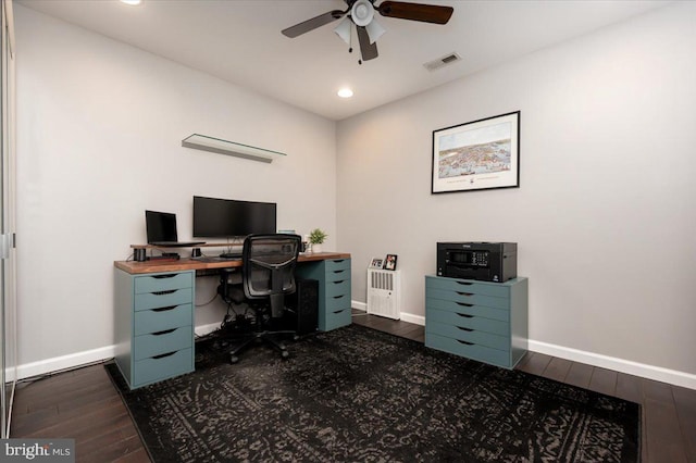 office space featuring ceiling fan and dark hardwood / wood-style flooring