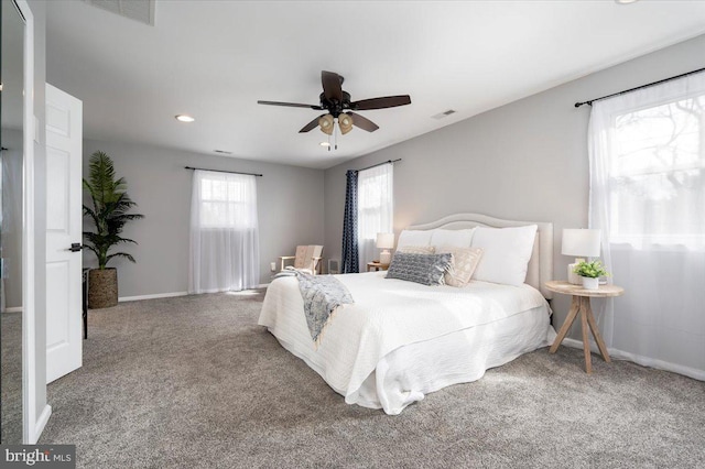 carpeted bedroom featuring ceiling fan