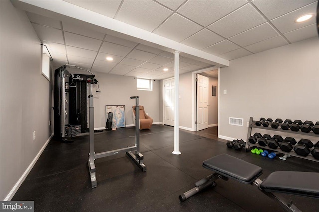 workout room with a drop ceiling