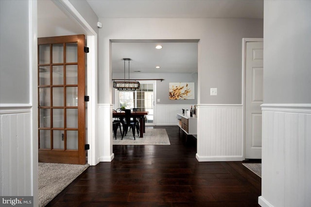 hall with dark hardwood / wood-style flooring