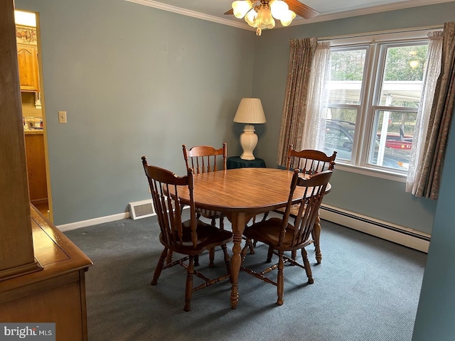 dining space featuring a baseboard heating unit, crown molding, ceiling fan, and dark colored carpet