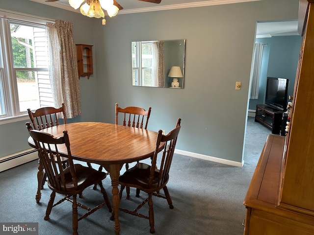 carpeted dining room with crown molding, ceiling fan, and baseboard heating