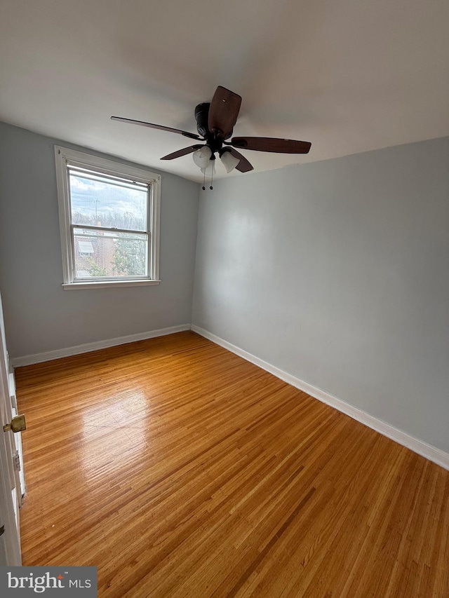 spare room featuring ceiling fan and light hardwood / wood-style flooring