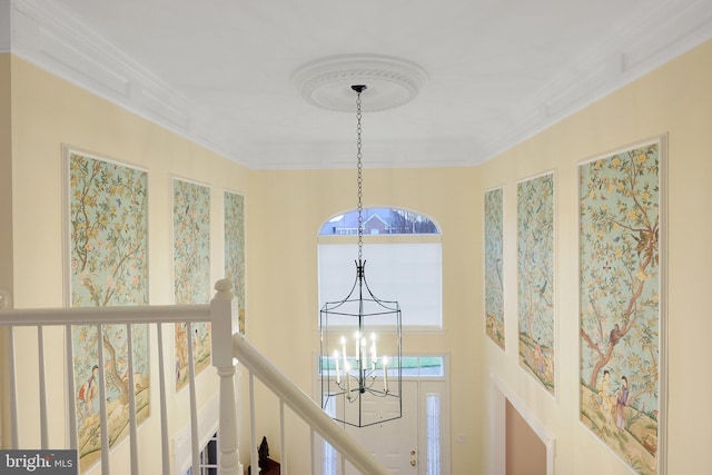 details with crown molding and a notable chandelier