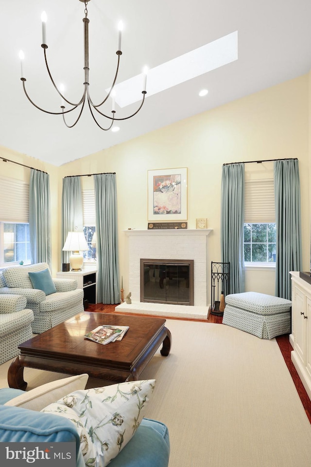 living room featuring wood-type flooring, vaulted ceiling, and a chandelier