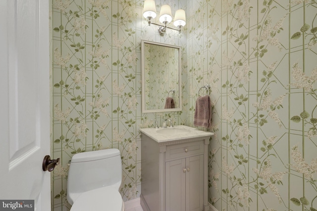 bathroom featuring vanity and toilet