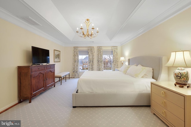 carpeted bedroom featuring ornamental molding, a tray ceiling, and a notable chandelier