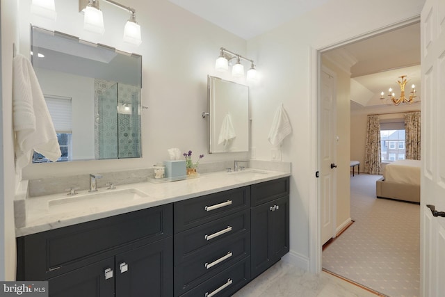 bathroom with vanity and an inviting chandelier