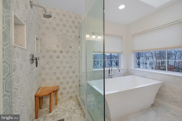 bathroom with shower with separate bathtub