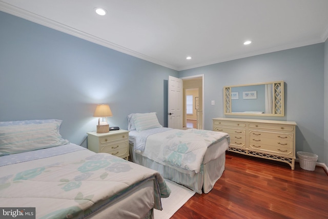 bedroom with crown molding and dark wood-type flooring