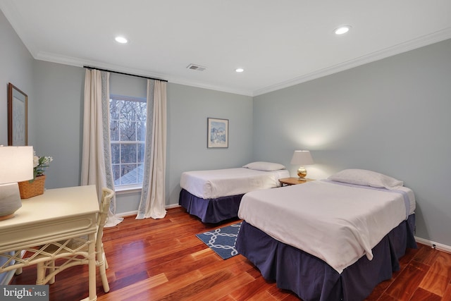 bedroom featuring crown molding and hardwood / wood-style floors