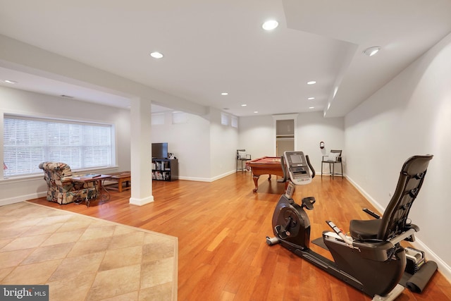 exercise area with light hardwood / wood-style floors