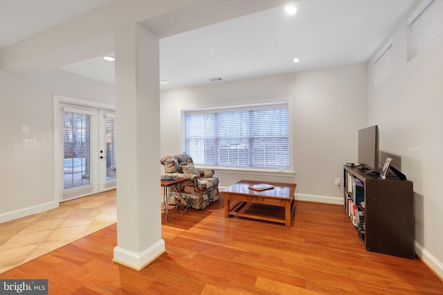 sitting room featuring a healthy amount of sunlight and light wood-type flooring