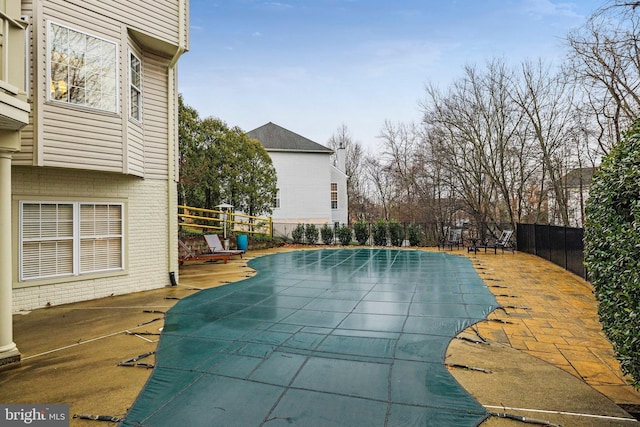 view of swimming pool featuring a patio area