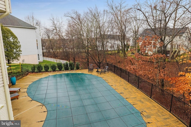 view of swimming pool featuring a patio area