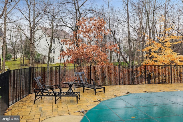 view of pool featuring a patio area