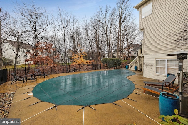 view of swimming pool featuring a patio