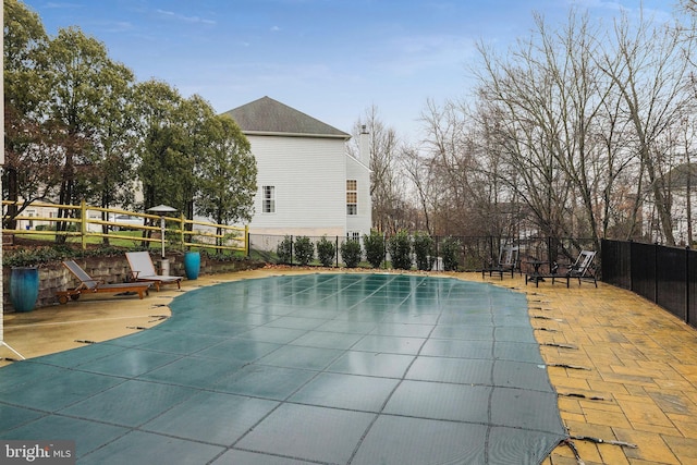 view of swimming pool featuring a patio