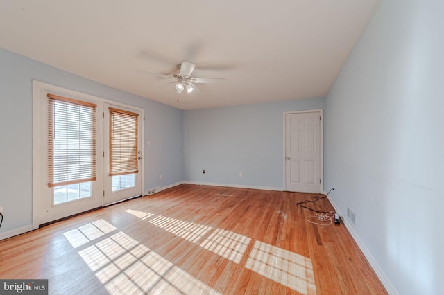 spare room with ceiling fan and light hardwood / wood-style flooring