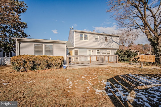 back of house featuring a wooden deck