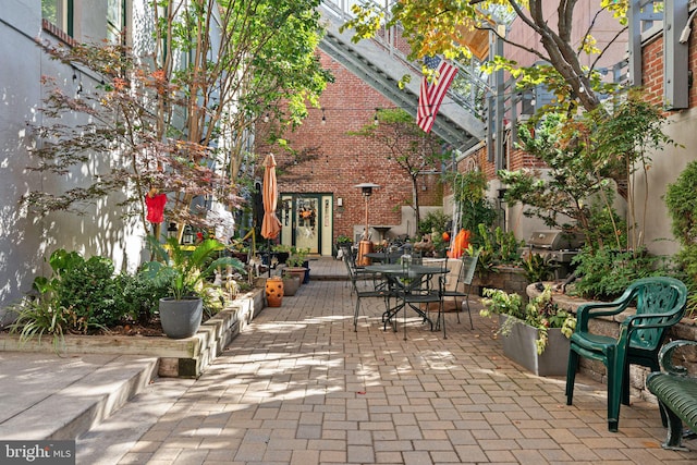 view of patio featuring a grill