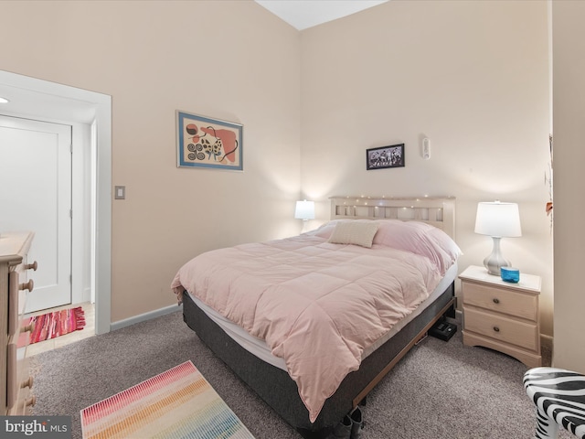 bedroom featuring dark colored carpet