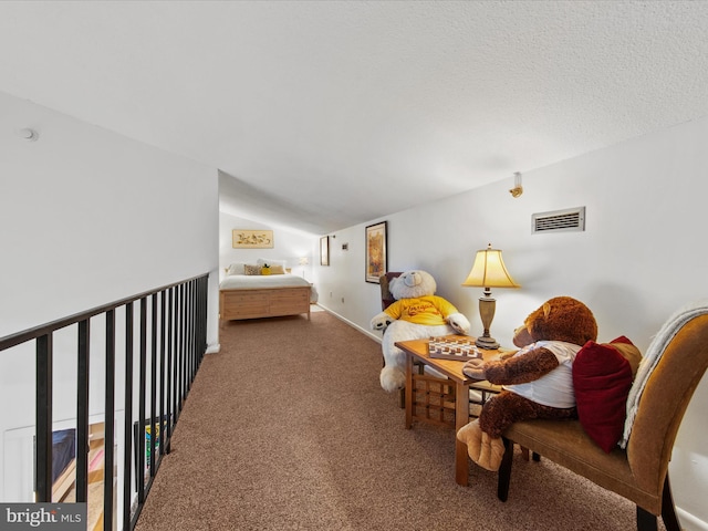 living area with lofted ceiling, a textured ceiling, and carpet flooring