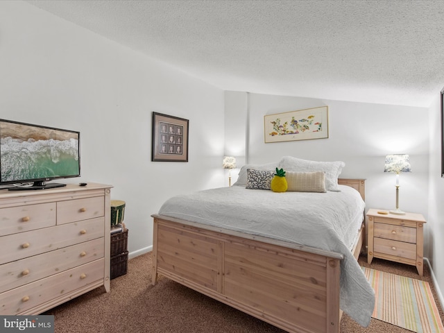 carpeted bedroom featuring lofted ceiling and a textured ceiling