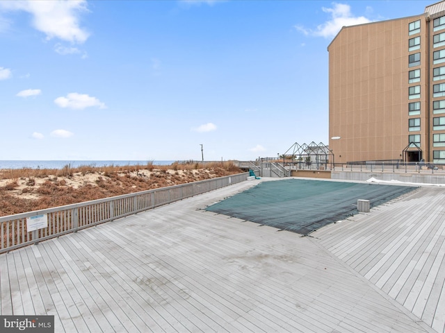 view of pool featuring a water view