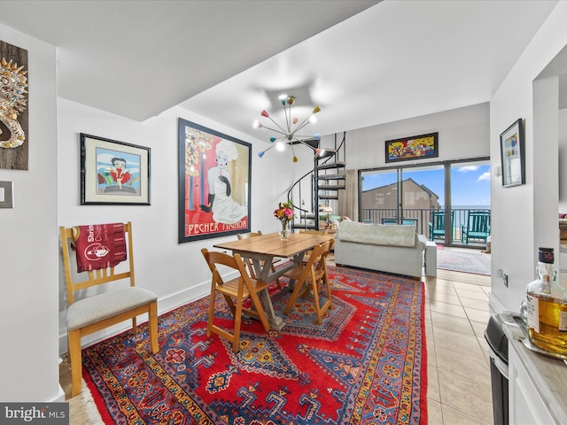 dining area featuring an inviting chandelier and light tile patterned floors