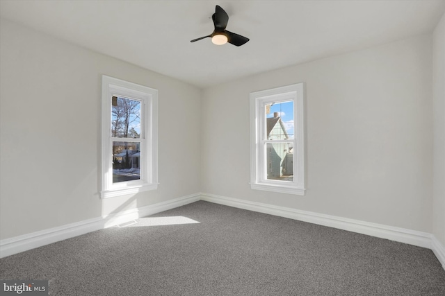 carpeted empty room featuring ceiling fan