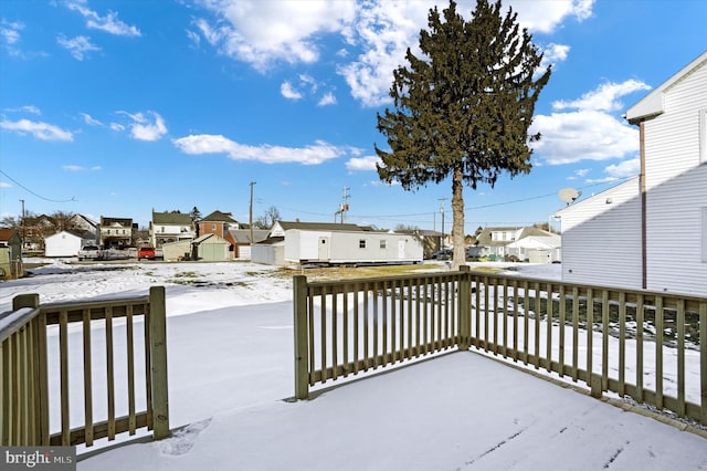 view of snow covered deck