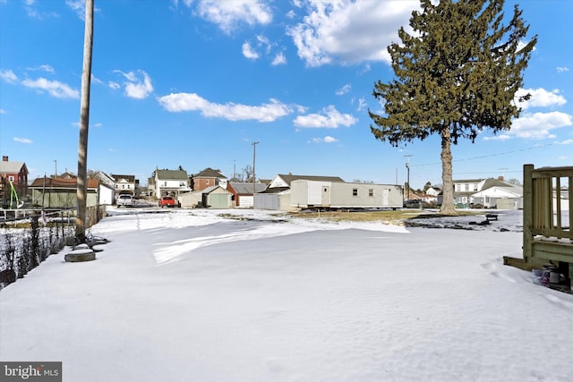 view of yard covered in snow