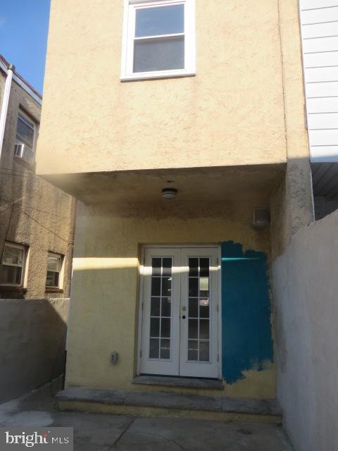 entrance to property featuring french doors