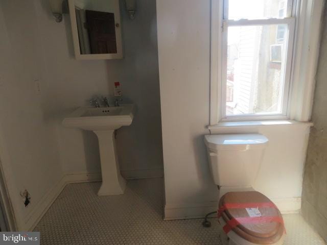 bathroom featuring tile patterned floors and toilet