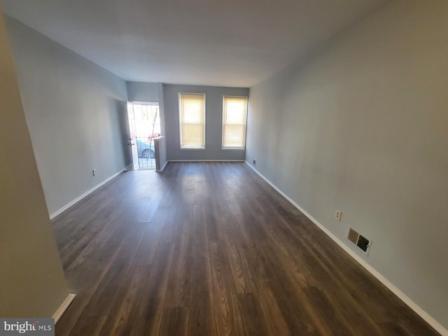 empty room featuring dark hardwood / wood-style floors