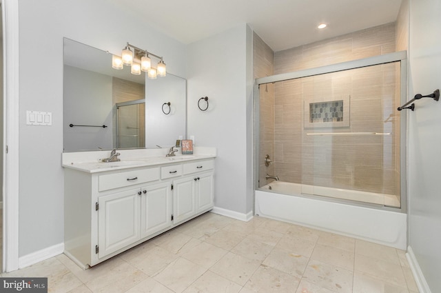 bathroom featuring vanity and shower / bath combination with glass door