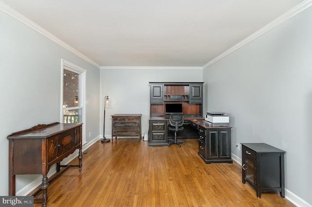 office area featuring ornamental molding and light hardwood / wood-style floors