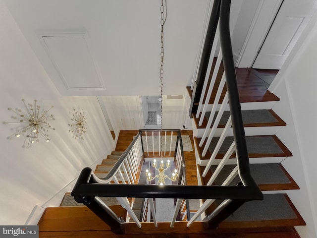 stairway with an inviting chandelier