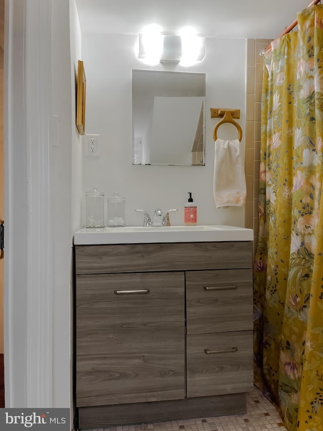 bathroom with vanity and curtained shower