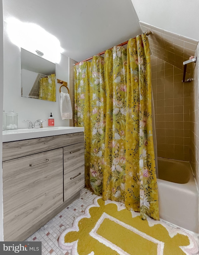 bathroom featuring vanity, tile patterned flooring, and shower / bath combo with shower curtain