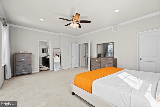 carpeted bedroom featuring ornamental molding, ceiling fan, and ensuite bathroom