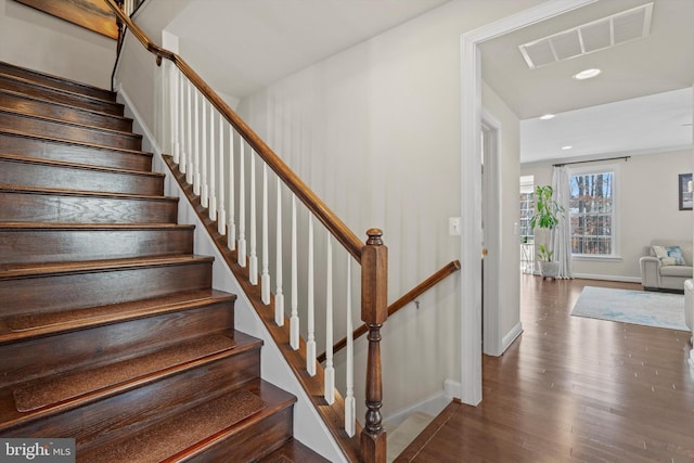 stairway featuring hardwood / wood-style floors