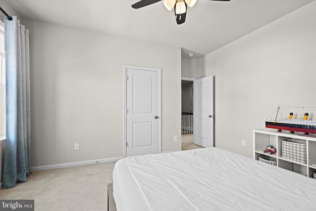 bedroom featuring light carpet and ceiling fan