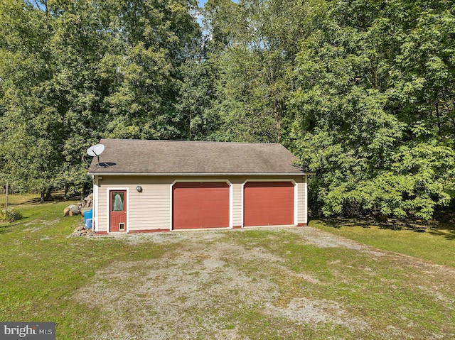 garage with a yard