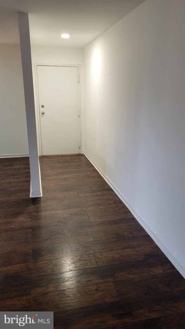 interior space with dark wood-type flooring