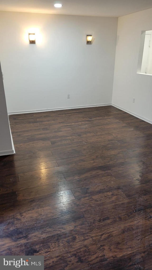 empty room featuring dark hardwood / wood-style floors