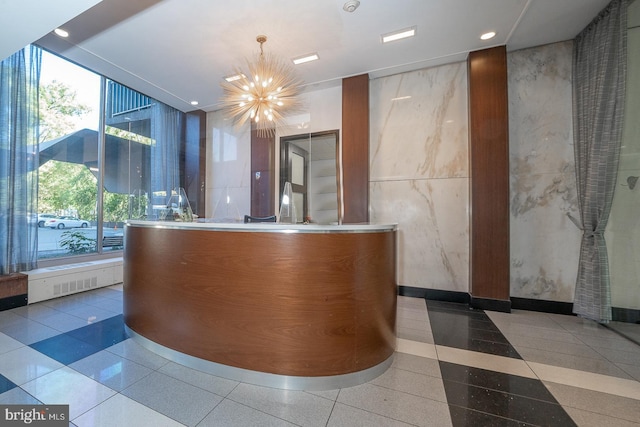 reception area with an inviting chandelier